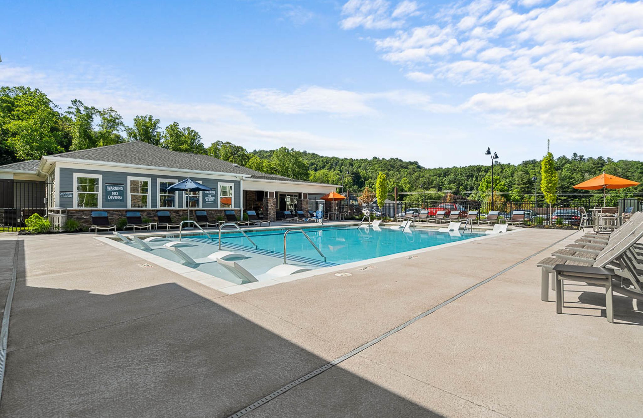 Hawthorne at Mills Gap luxury outdoor pool with in-pool lounge chairs and surrounding seating